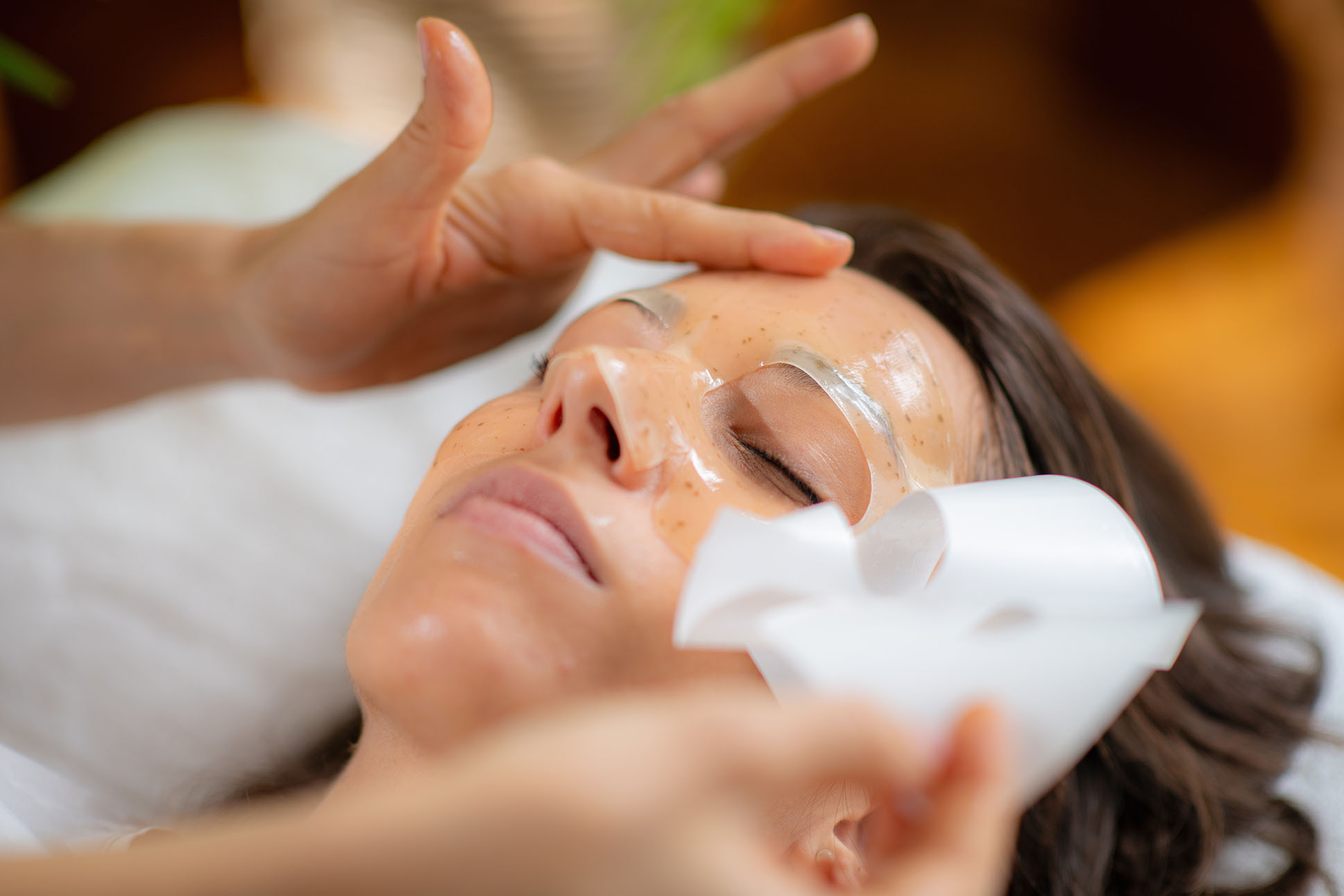 Client receiving a soothing hydrating mask and eye treatment during a Hideaway facial
